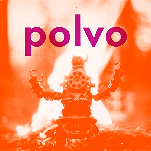 A toy robot stands against a bright orange background with the word Polvo above.