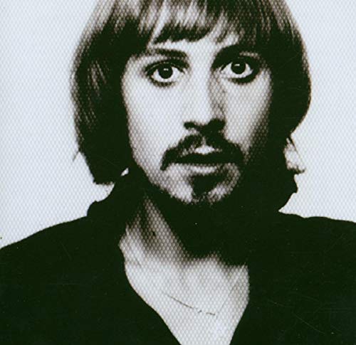 Black and white portrait of a man with a mustache and dark hair.