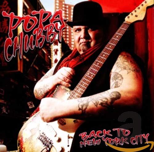 Popa Chubby album cover featuring a guitarist with tattoos and a hat.