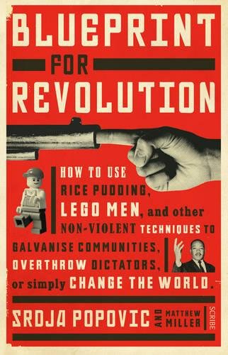 Book cover: red background, hand pointing at a toy gun and Lego figure.