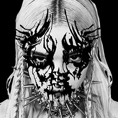 Black and white portrait of Poppy with black paint over eyes and spiked choker.
