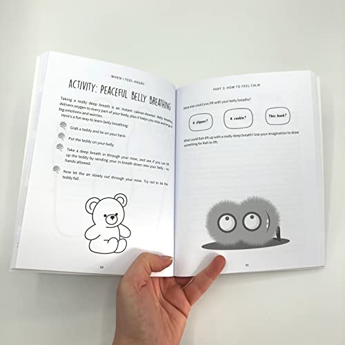 Open book displays illustrations of a teddy bear and fluffy monster.
