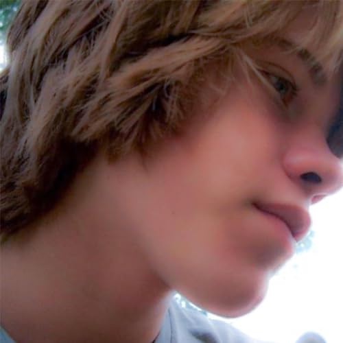 Close-up of a young person with short, light brown hair.