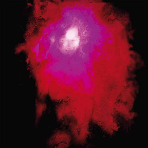 A blurry human face emerges from a swirling cloud of red and purple smoke.
