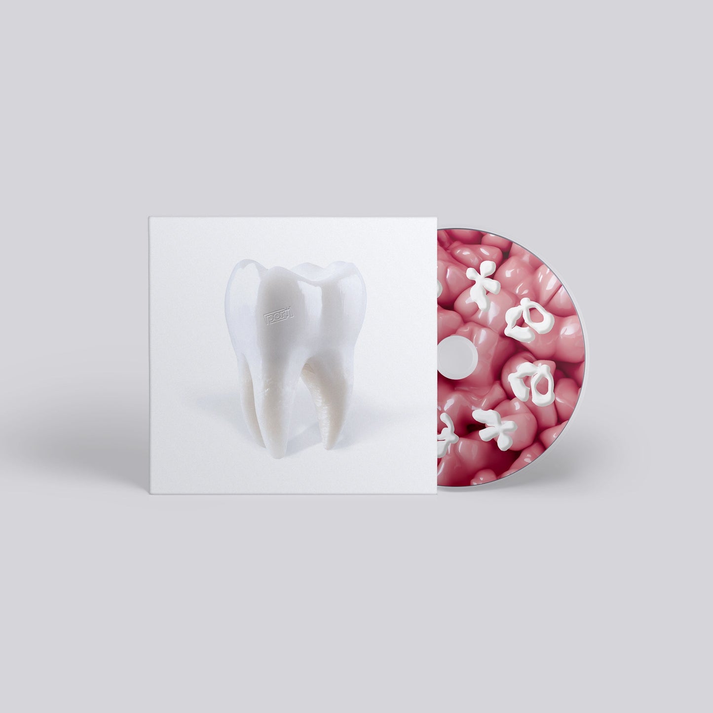 CD case with a tooth illustration and a pink, flower-shaped disc.