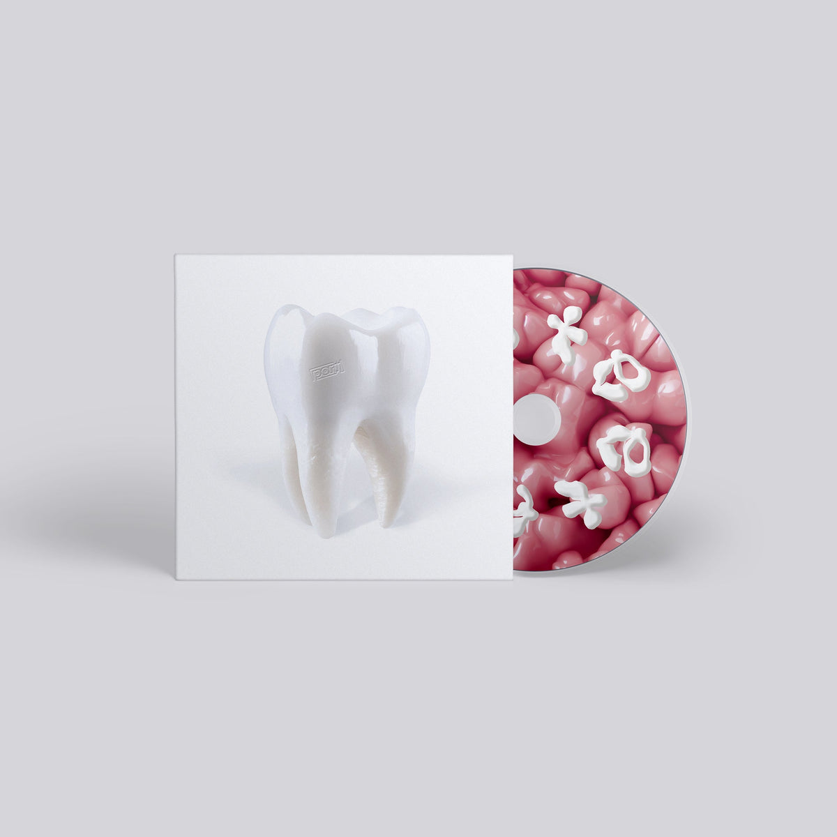 CD case with a tooth illustration and a pink, flower-shaped disc.