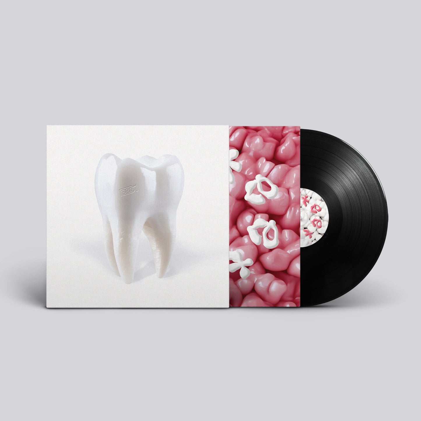 Vinyl record cover featuring a tooth illustration and pink candies.