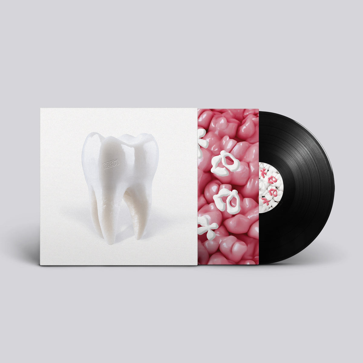 Vinyl record cover featuring a tooth illustration and pink candies.