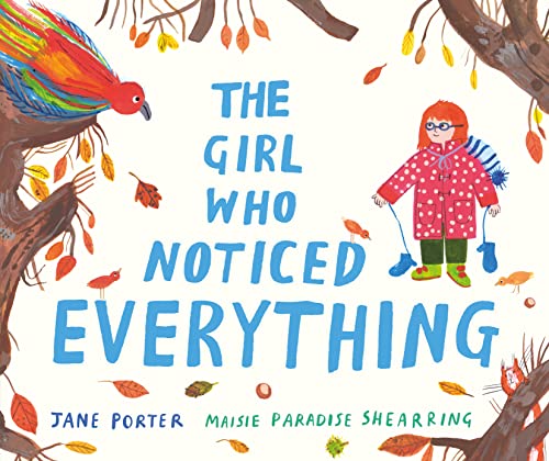 A girl in a red coat stands among trees with a colorful bird.