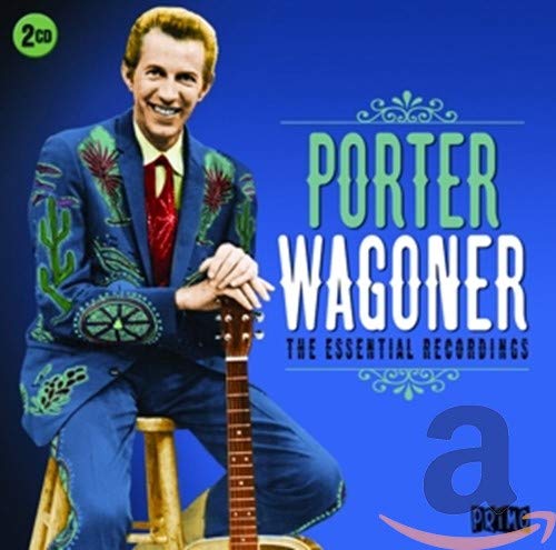 Porter Wagoner in a blue embroidered suit sitting on a stool with a guitar.