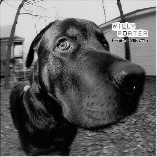 Black and white close-up of a dog’s face, album cover art.