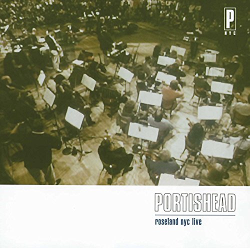 High-angle view of an orchestra performing on stage with text Portishead Roseland NYC Live.