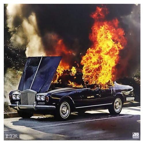 Burning car with open hood, album cover for Portugal. The Man’s “Woodstock.”