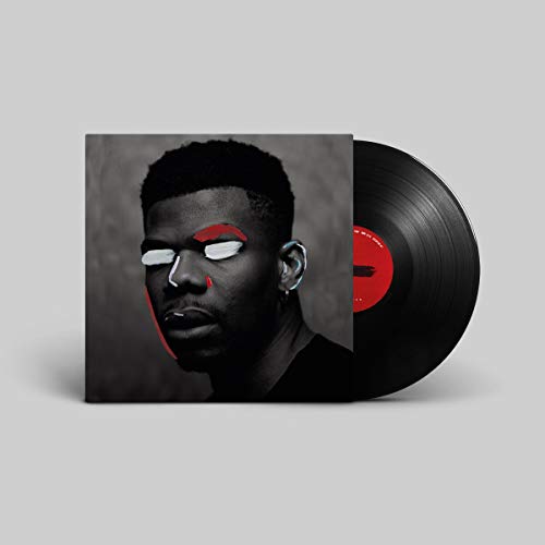 Vinyl record and album cover featuring a portrait of a Black man.