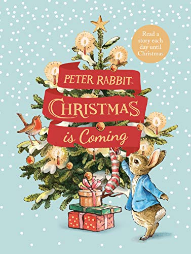 Peter Rabbit stands by a decorated Christmas tree on a light blue snowy background.