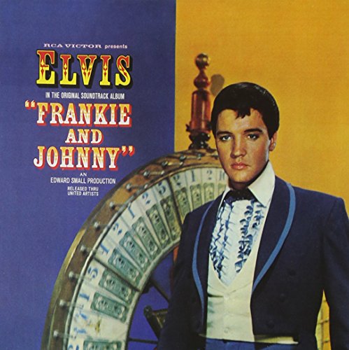 Elvis Presley in a tuxedo standing in front of a roulette wheel on album cover.