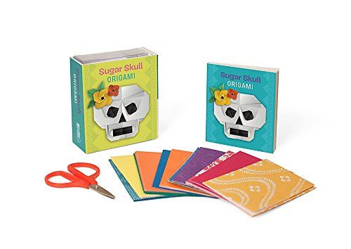 Origami kit with two books showing sugar skull designs and colorful paper.
