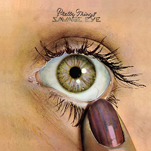 Album cover: close-up of a green eye with long lashes and lipstick.