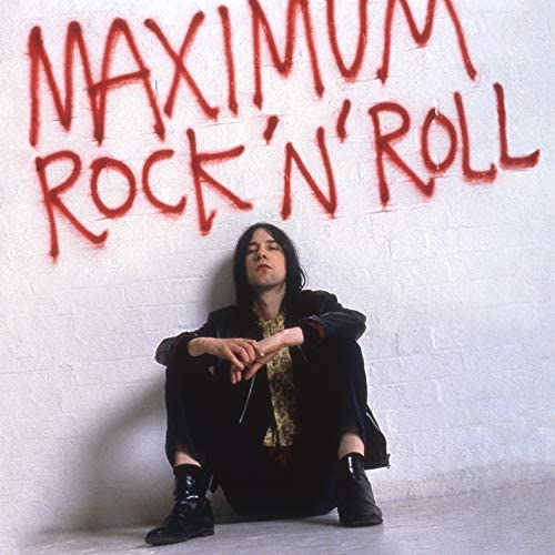 Album cover for Primal Scream featuring a man leaning against a wall.