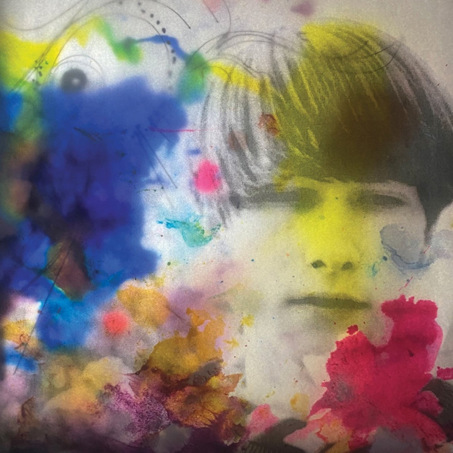 Abstract portrait of a man with colorful paint splatters and textures.