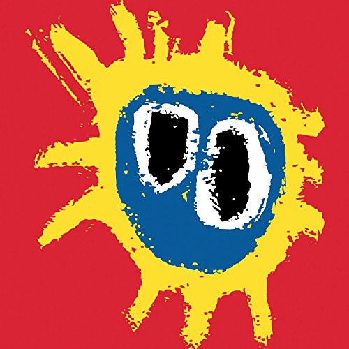 Red background with a yellow, spiky sunburst and blue, eye-like center.