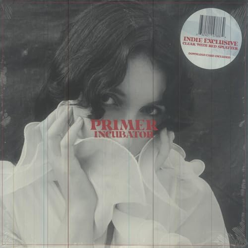 Vinyl record cover: woman’s face, white fabric, red splatter, barcode sticker.