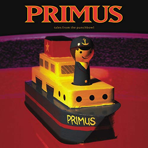 A toy boat with a captain on top and the word Primus on front.