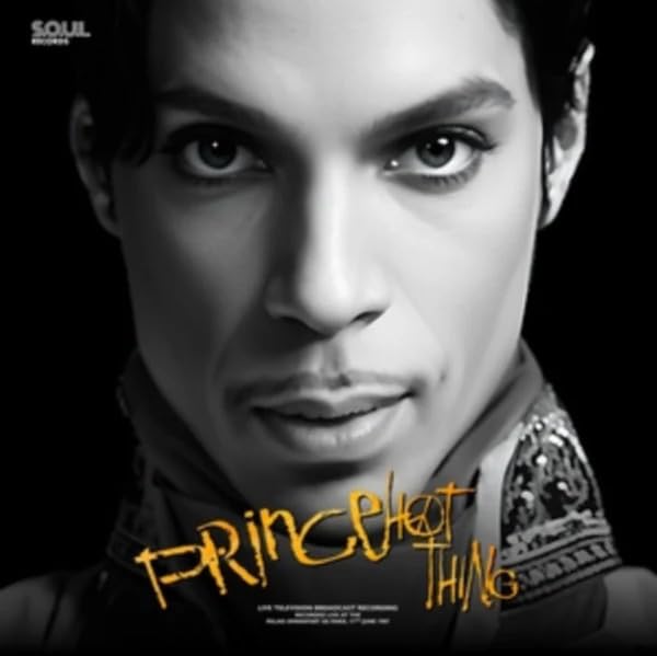 Close-up black and white portrait of Prince, with album title overlay.