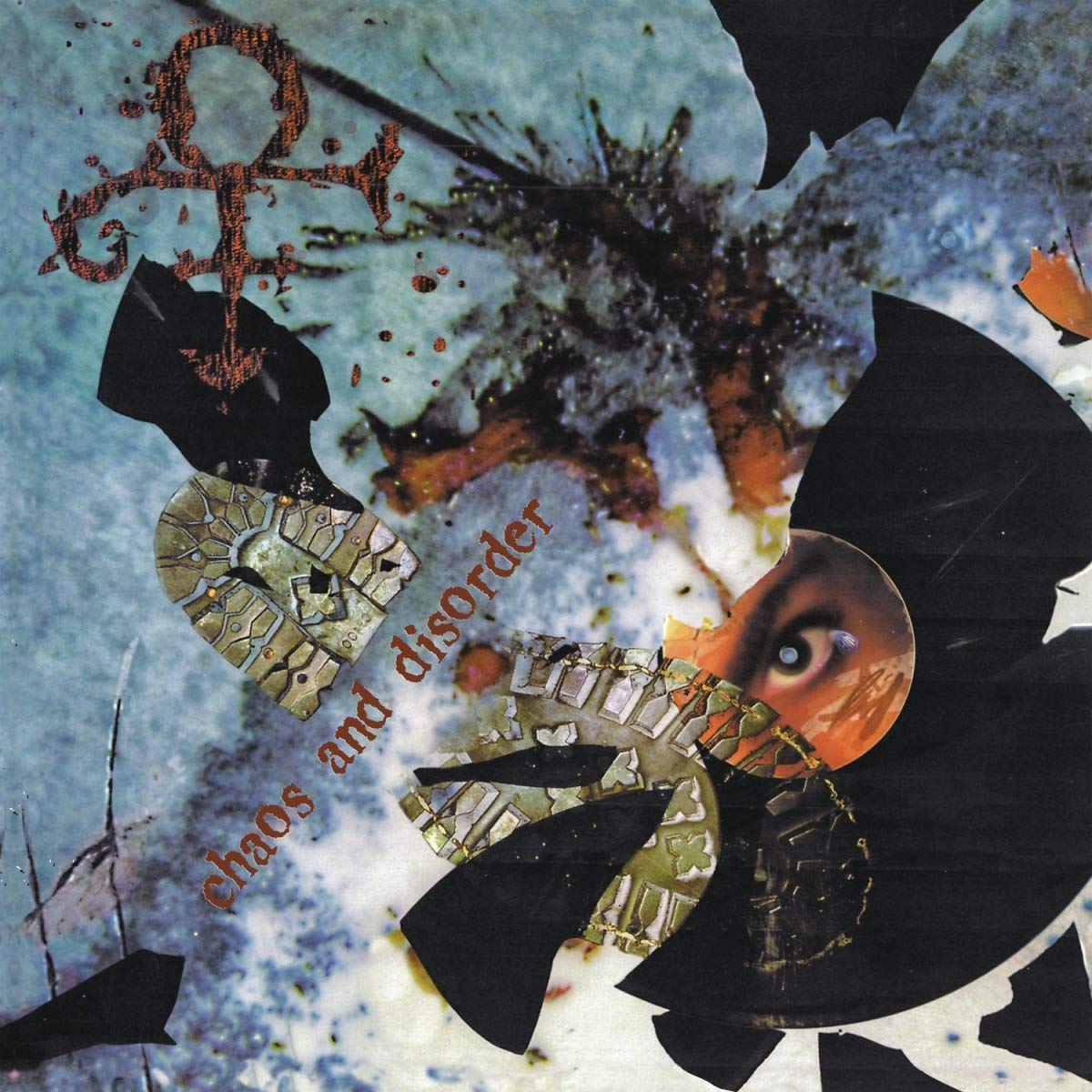 "Album cover with torn vinyl, Prince's symbol, and the title 'chaos and disorder'."