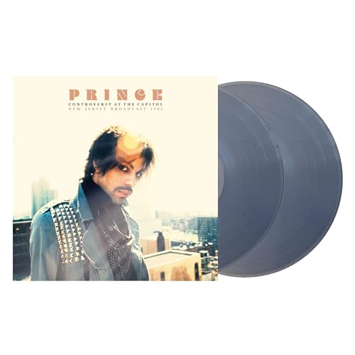 Prince album cover and clear vinyl record, side view.