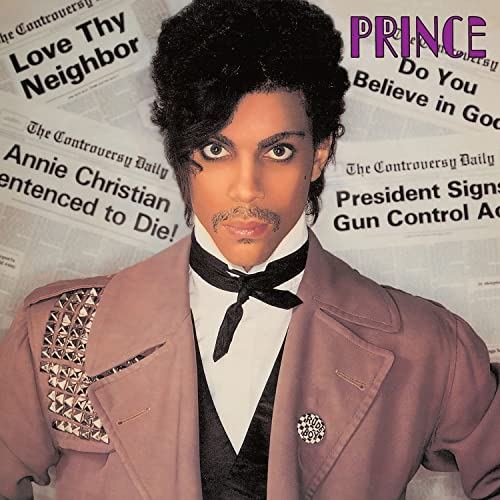 Prince wearing a brown coat and black necktie against a background of newspaper headlines.