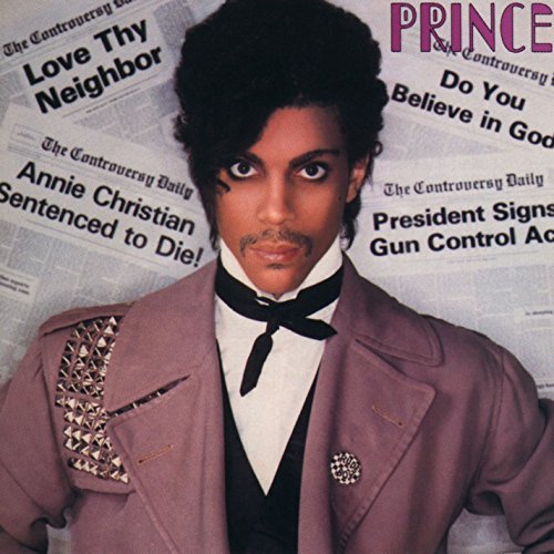 Prince's album cover featuring him in a pink jacket against a newspaper background.