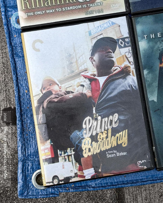 Prince of Broadway" Blu-ray cover featuring a man and child in Times Square.