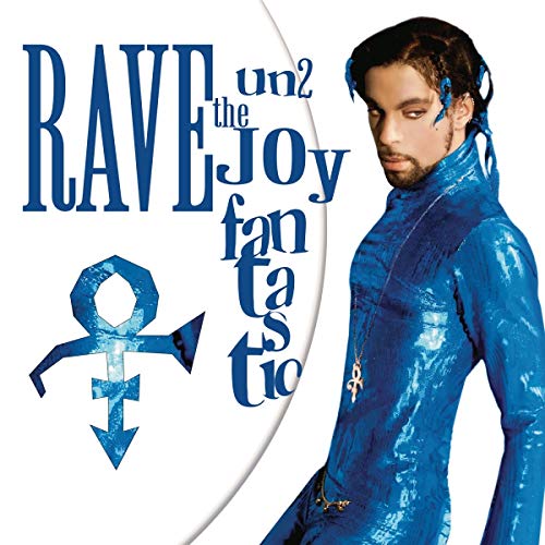 Prince in a shiny blue jumpsuit on a vinyl record cover.