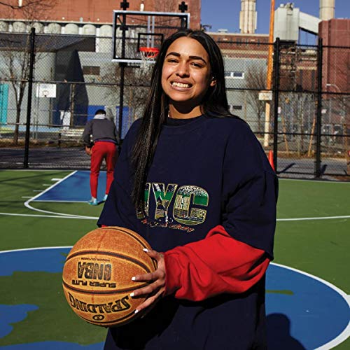 Princess Nokia holds a basketball on a city basketball court.