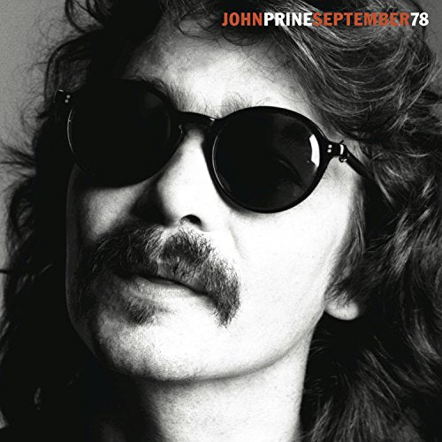Black and white album cover featuring John Prine wearing sunglasses.