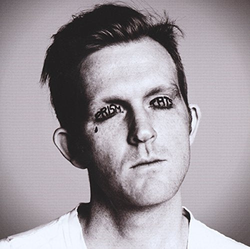 Black and white photo of a man with "Prism Tats" written above his eyes.