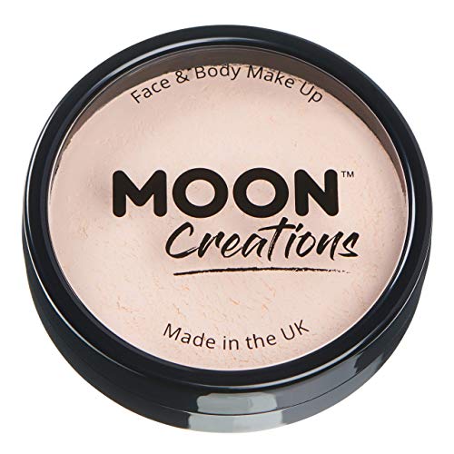 A circular black container of pale skin-toned face and body paint by Moon Creations.