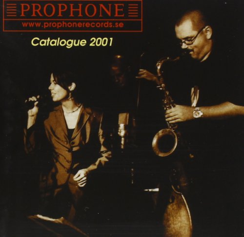 CD cover: singer with microphone and saxophone player in low light.