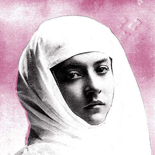 Black and white portrait of a nun against a pink background.