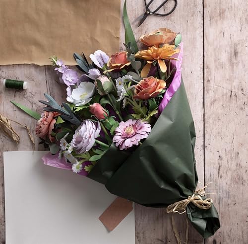 Paper flower bouquet tied with twine on a wooden surface.