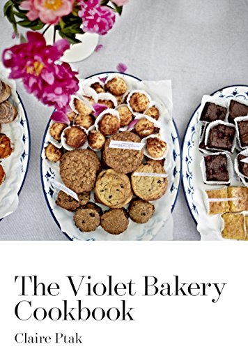 The image shows a cookbook cover featuring assorted baked goods on decorative plates.