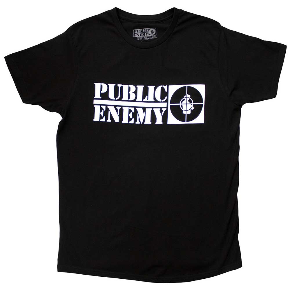 A man wearing a black t-shirt with a white Public Enemy crosshairs logo.