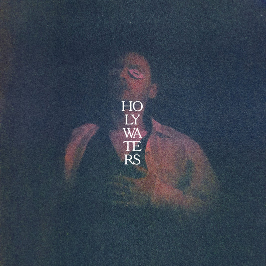 A dimly lit, grainy portrait of a man with the text Holy Waters overlaid.