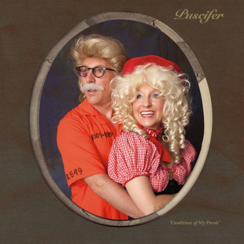 Puscifer album cover: two people in wigs and vintage clothing.