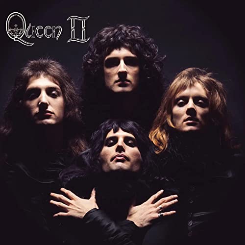 Queen band portrait from the album cover of “Queen II”, dark background.