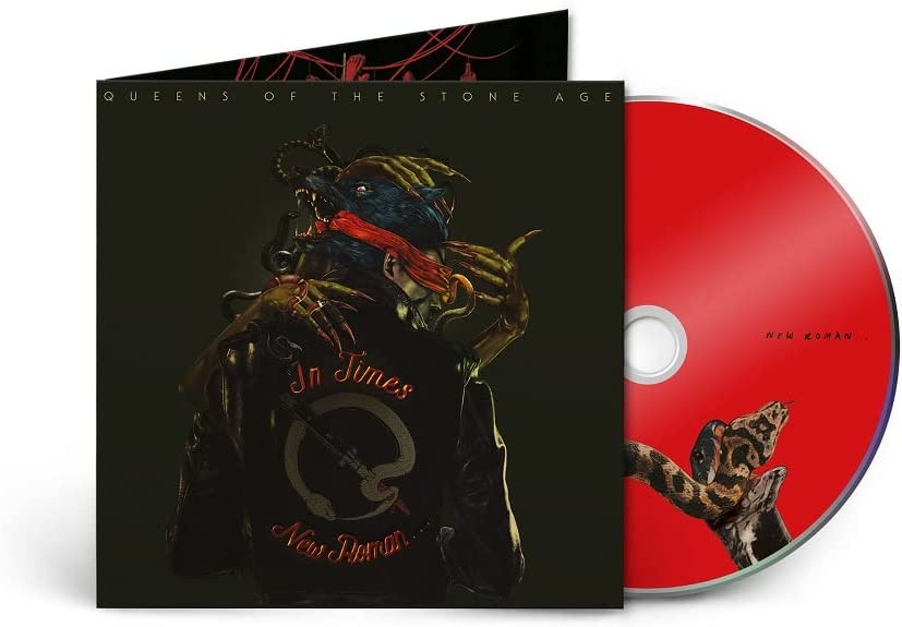 Queens of the Stone Age album cover, “In Times New Roman,” featuring a distorted face.