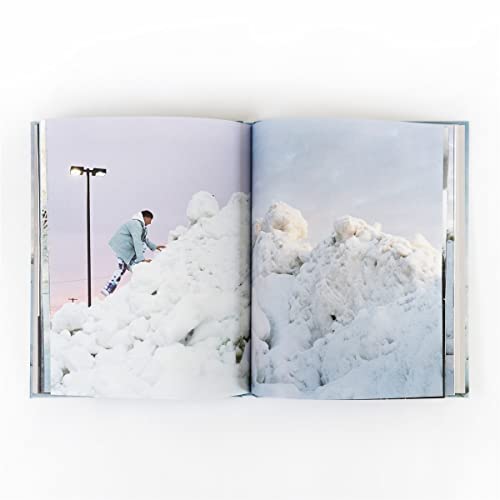 CD booklet open to a snowy landscape with a person climbing a drift.