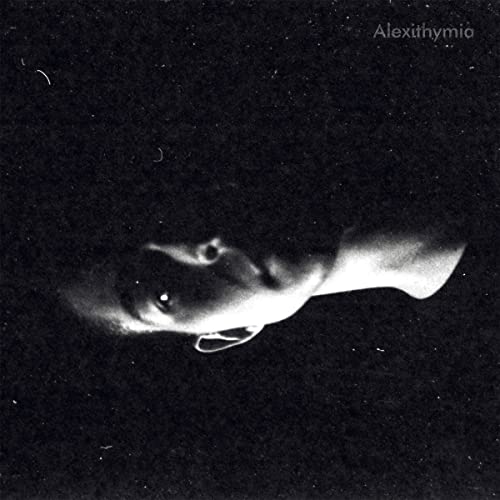 Black and white album cover featuring a partially obscured face.