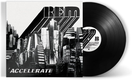 "Black vinyl record with white label, sleeve features cityscape and 'R.E.M. Accelerate' text."